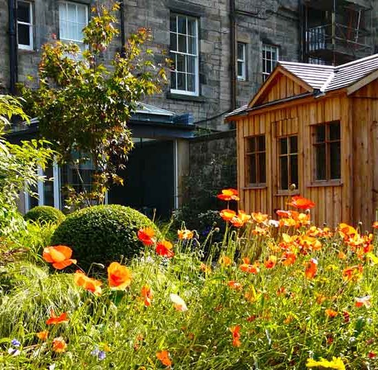 Scorched oak bench, Urbis lily bowl, Edinburgh Eton Terrace garden, built by Water Gems, designed by Carolyn Grohmann, BALI award winning 2014