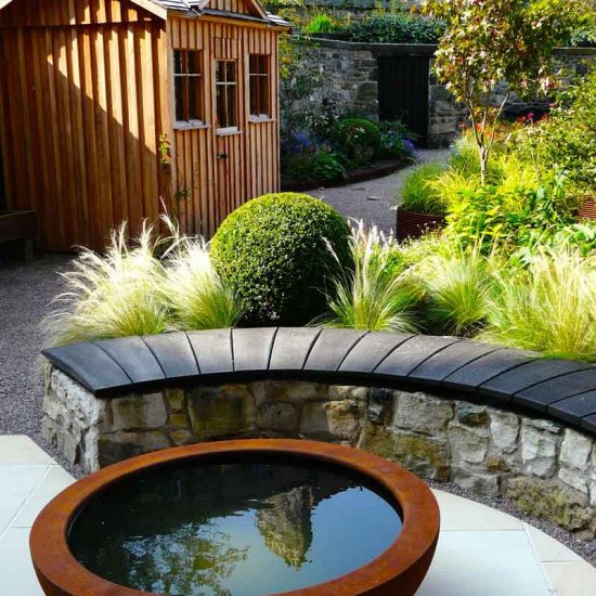 Scorched oak bench, Urbis lily bowl, Edinburgh Eton Terrace garden, built by Water Gems, designed by Carolyn Grohmann, BALI award winning 2014