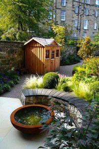 Scorched oak bench, Urbis lily bowl, Edinburgh Eton Terrace garden, built by Water Gems, designed by Carolyn Grohmann, BALI award winning 2014