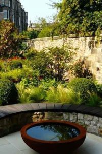 Scorched oak bench, Urbis lily bowl, Edinburgh Eton Terrace garden, built by Water Gems, designed by Carolyn Grohmann, BALI award winning 2014