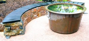 Aviemore garden, drystone bench, scorched oak seat, built by Water Gems, designed by Carolyn Grohmann, copper tub by Ratho Byres Forge