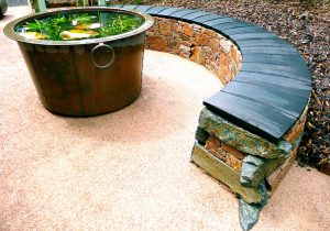 Aviemore garden, drystone bench, scorched oak seat, built by Water Gems, designed by Carolyn Grohmann, copper tub by Ratho Byres Forge