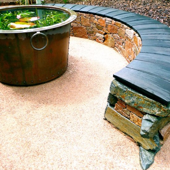 Aviemore garden, drystone bench, scorched oak seat, built by Water Gems, designed by Carolyn Grohmann, copper tub by Ratho Byres Forge