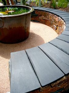 Aviemore garden, drystone bench, scorched oak seat, built by Water Gems, designed by Carolyn Grohmann, copper tub by Ratho Byres Forge