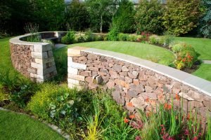 Portfolio image, Colinton Garden, built by Water Gems, curved stone retaining walls, planted borders, lawn areas