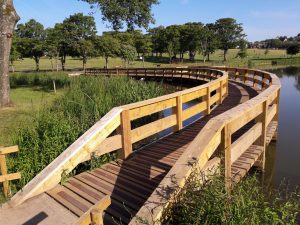 Portfolio image, Kay Park Pond, curved Boardwalk, edge planting