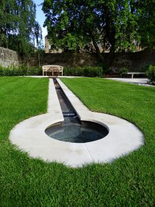 Shallow rill with small weirs leading to the small bowl.