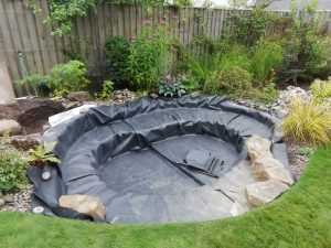 Small pond and cascade, Fife garden, liner being installed